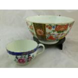 A Worcester porcelain teacup with fluted body and shaped handle, decorated in underglaze blue and