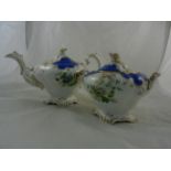 A 19th century English porcelain teapot and lidded sugar bowl with rose head finials, raised on