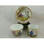 An early 19th century Minton porcelain trio decorated with Oriental gentlemen in the manner of