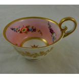 An 19th century porcelain tea cup with kidney shaped handle, possibly Nantgarw or Coalport,