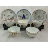 A collection of five various 18th century porcelain tea bowls and saucers,