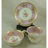 An H & R Daniel porcelain trio, Etruscan shape, decorated with a pink band containing gilt floral