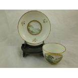 A Pinxton porcelain teacup and saucer, each decorated with floral sprigs  and hand painted