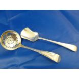 A Victorian silver sifter spoon, Sheffield 1898, and a Victorian silver sugar shovel,