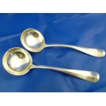 A pair of George V Hanoverian and rat tail pattern heavy gauge silver sauce ladles, London 1926, 15.