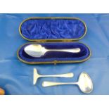 A George V Hanoverian and rat tail pattern silver jam spoon, Sheffield 1932, 14cm long, cased,