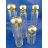 A set of five Victorian silver mounted cut glass dressing table jars,