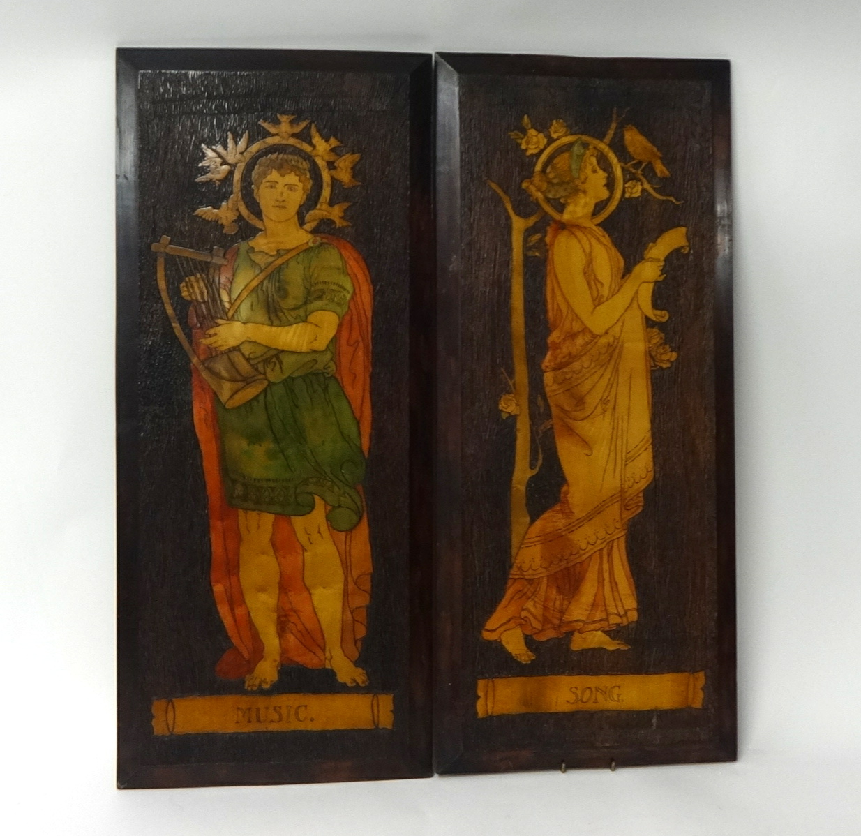 Pair of Art Nouveau wood panels with inlaid decoration titled 'Music' and 'Song', 78cm x 33cm