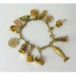 A gold charm bracelet stamped 14k, JAW of Chinese design, 20.30g