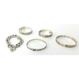 Four silver bangles t/w a silver curb link bracelet with padlock clasp, approximately 170g