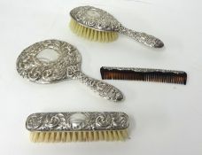Four piece brush and comb set in navy fitted case