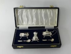 A modern silver five piece silver condiment set  in fitted case