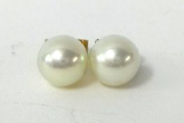 Pair of single pearl and yellow metal earrings possibly Mikimoto