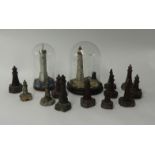 Collection of small serpentine and other lighthouses including two under dome (14)