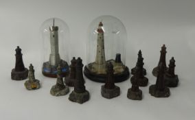 Collection of small serpentine and other lighthouses including two under dome (14)