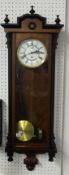 Vienna style single train wall clock, with pendulum and brass cased weight, approximately 116cm