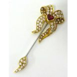 A fine 18ct ruby and diamond jabot pin set with 63 diamonds and heart shaped ruby RG Ltd, with