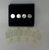 Four Historic Coins of Great Britain each one ounce silver Britannia, approximately 129.6g, cased