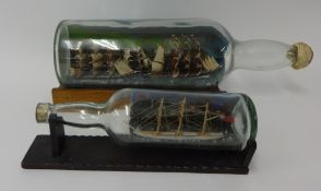 Two ships in bottles, largest 50cm