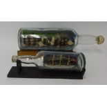 Two ships in bottles, largest 50cm