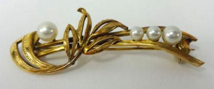 Yellow metal brooch set with four pearls, stamped JAW