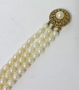Three row uniform cultured pearl necklet with 9ct yellow gold cultured and seed pearl pierced
