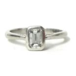 A platinum and diamond solitaire ring set with emerald cut diamond, approximately 0.40 ct, F-G