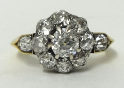 Fine eleven stone round diamond cluster ring set in 18ct gold and platinum, size M, centre stone