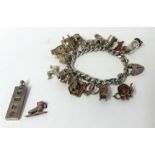 Silver charm bracelet and silver ingot