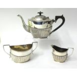 Edwardian three piece silver tea set, half fluted design, 31oz