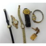 Four Ladies watches, gold fob watch and 9ct gold T bar and yellow metal locket