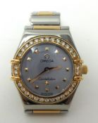 Lady's steel and rose gold Omega Constellation quartz watch with mother of pearl dial with diamond