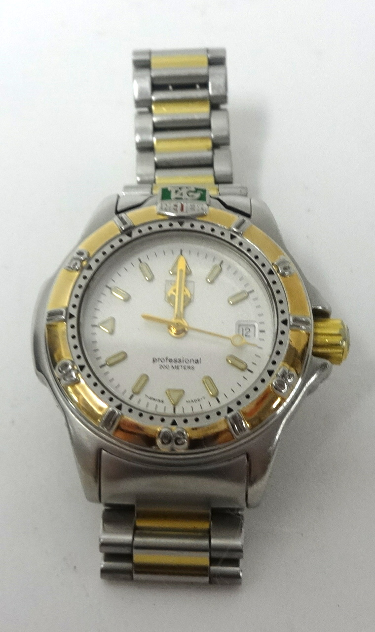 Lady's bi metal Tag Heuer professional quartz watch with cream coloured dial luminous baton markings