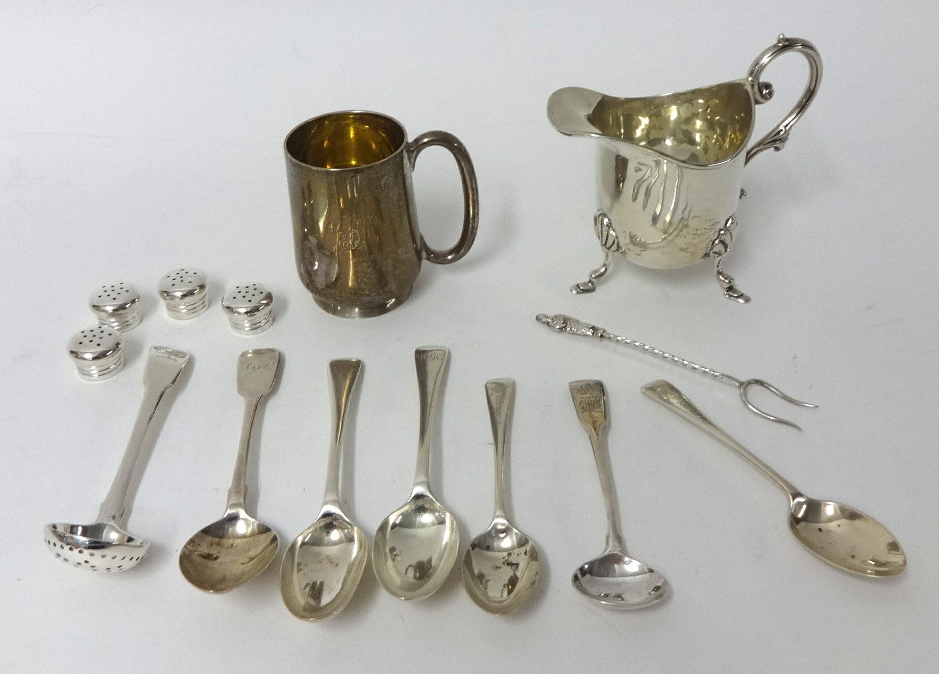 Small silver tankard, silver cream jug, various silver spoons and castor approximately 11.20 oz