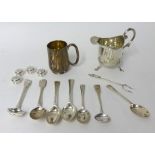 Small silver tankard, silver cream jug, various silver spoons and castor approximately 11.20 oz