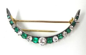 Antique emerald and diamond crescent brooch, approximately 4.5cm wide
