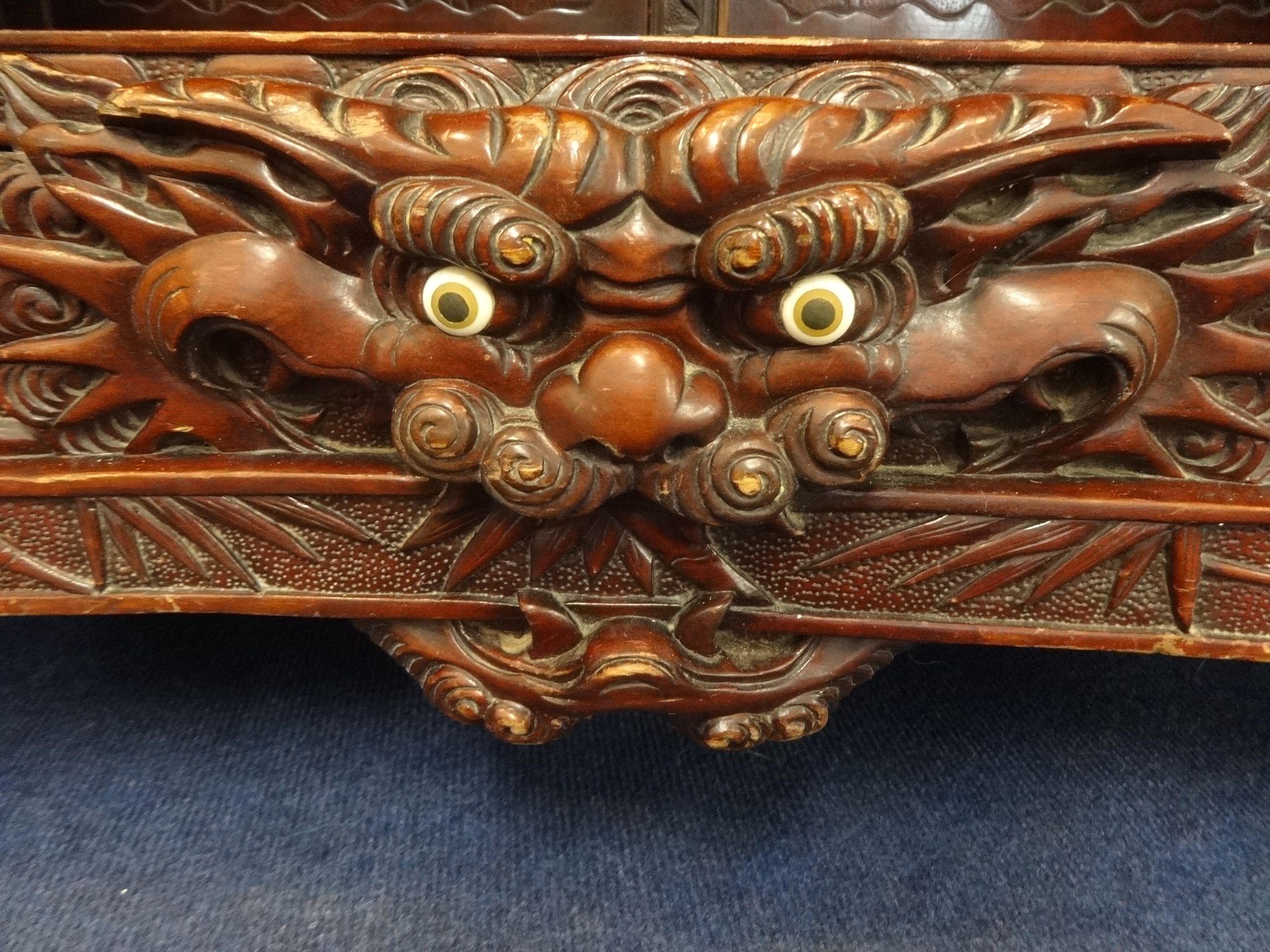 A Chinese cabinet, carved throughout with stylised  bamboo planets, water lilies and dragon's, - Image 3 of 4