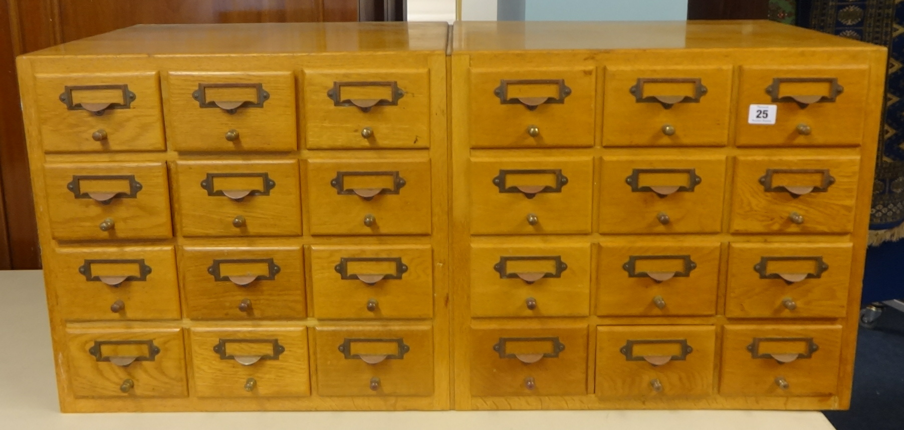 A bank of 24 index drawers, width 102cm