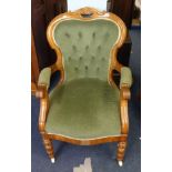 Victorian mahogany framed and upholstered elbow chair on china castors