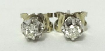 Pair of white gold single stud diamond earrings approximately .10ct each, circa 1977