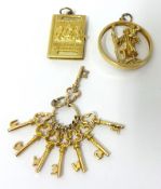 Three gold charms stamped 9K, approximately 12.4g