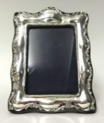 A  George V silver photo frame, 21cm x 16cm