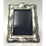 A  George V silver photo frame, 21cm x 16cm