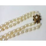 Two uniform cultured pearl necklet with 9ct yellow gold sapphire and cultured pearl snowflake clasp