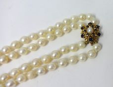 Two uniform cultured pearl necklet with 9ct yellow gold sapphire and cultured pearl snowflake clasp
