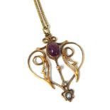 Art Nouveau yellow metal and gemstone pendant on fine chain