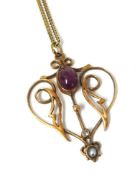 Art Nouveau yellow metal and gemstone pendant on fine chain