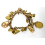 9ct gold charm bracelet with various charms including George V half sovereign 1913, 39.9g overall