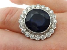 Sapphire and diamond oval cluster ring comprising large central oval cut sapphire, weight 10.06