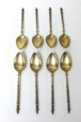Eight silver spoons stamped .800 with lattice work handles and finials, approximately 76.5g